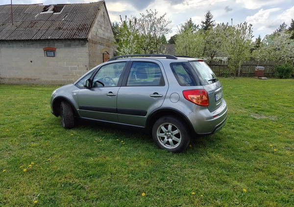 Suzuki SX4 cena 34500 przebieg: 135140, rok produkcji 2013 z Szczecinek małe 211